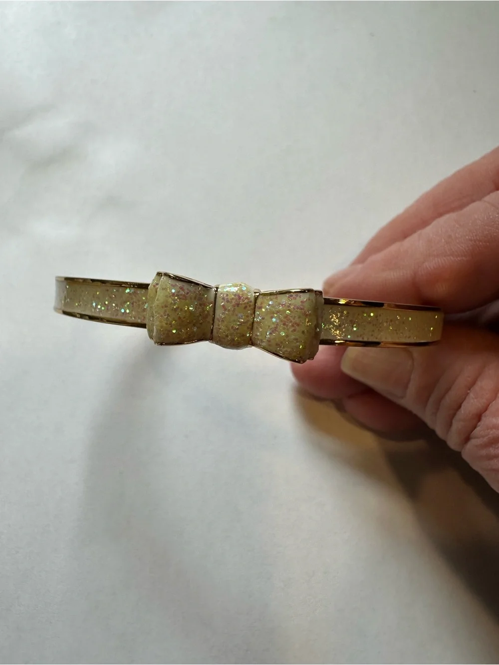 Kate Spade Gold Bow Bangle Bracelet with Iridescent Cream Inlay